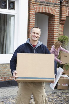 Removal team planning a flat move in Shoreditch on a busy East London street
