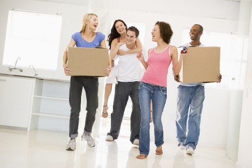 House removal team working with boxes in a Shoreditch apartment move