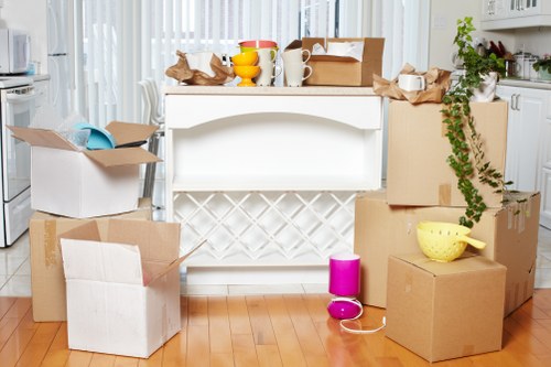 Professional movers carrying items through a Shoreditch flat or converted building