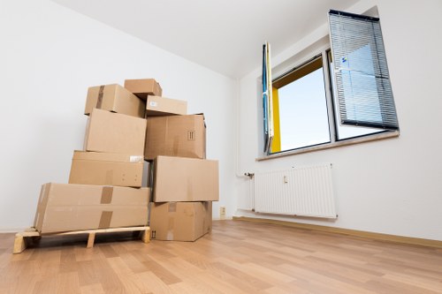 Local movers handling belongings in a Shoreditch apartment building
